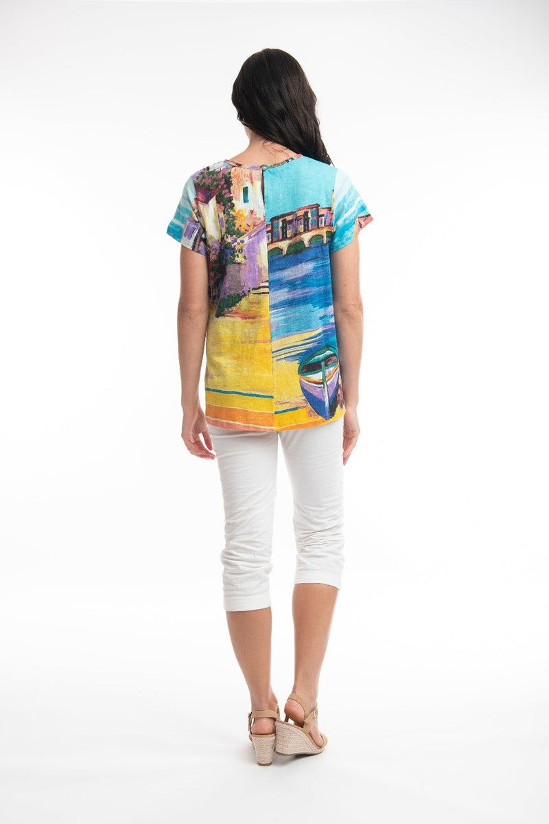 The printed t-shirt is a long line, contemporary, a-line loose fit. It is short sleeved with crew neckline.