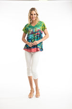The printed t-shirt is a long line, contemporary, a-line loose fit. It is short sleeved with a v-neck.