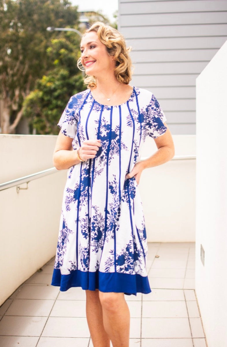 The S/S Ribbon Detail Navy Floral Dress is a cool & stylish summer style. 