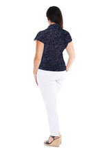 The Latina high neck top is a CF buttoning, form fitting garment with a flattering front v neckline & interesting back neck gathering detail. It has side splits & is shown worn back with the Modena Jaquard pant.